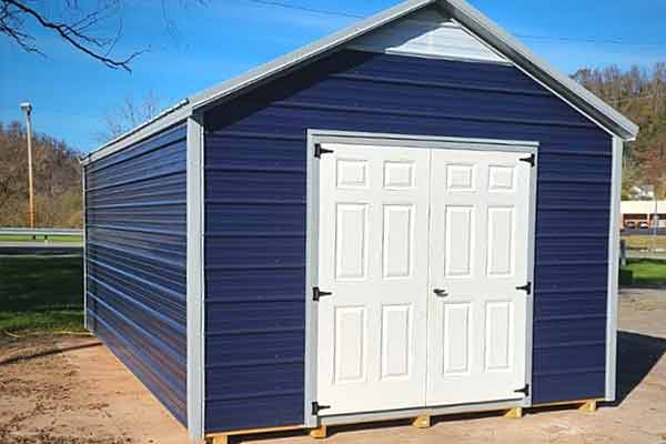 Metal Shed with deep blue siding with ribs installed horizontally