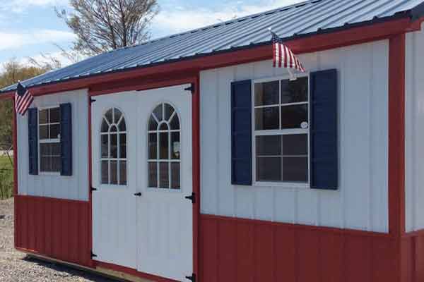 Red white and blue shed - red and white siding, red trim, blue roof and shutters